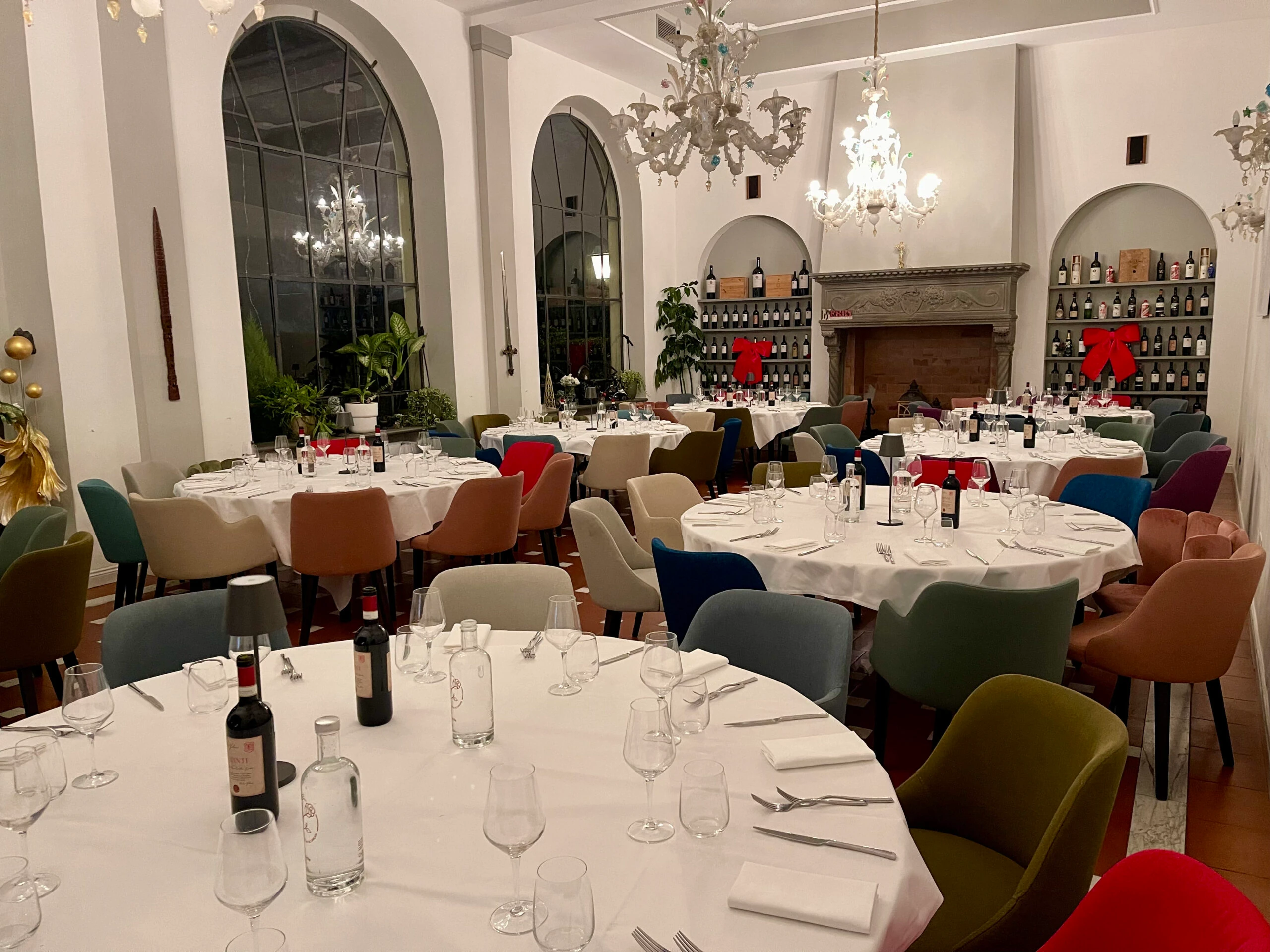 The villa's dining room, with glass chandeliers and the fireplace